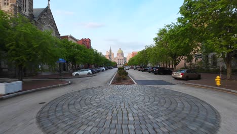 Aerial-FPV-shot-through-State-Street-in-downtown-Harrisburg-towards-Pennsylvania-capitol-building