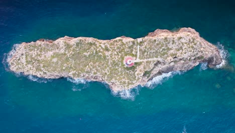 Aerial-top-down-ascend-over-Punta-de-El-Toro-limestone-island,-Mallorca