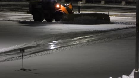 CAT-shoveling-snow-in-street,-Toronto,-Canada