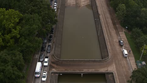 Drone-view-of-under-bridge-flooding-on-Allen-Parkway-in-Houston,-Texas