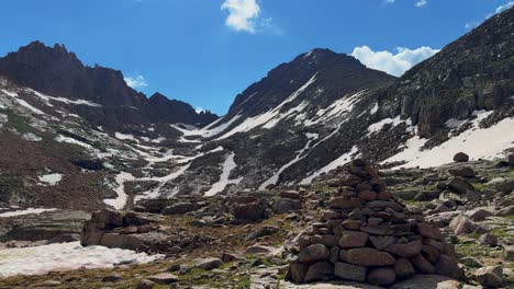 Cairns-hiking-landmark-Twin-Lakes-trail-Sunlight-Windom-Peak-Mount-Eulos-Silverton-summer-Twin-Lakes-Chicago-Basin-Colorado-Silverton-San-Juan-Range-Rocky-Mountains-fourteeners-July-bluesky-pan-left