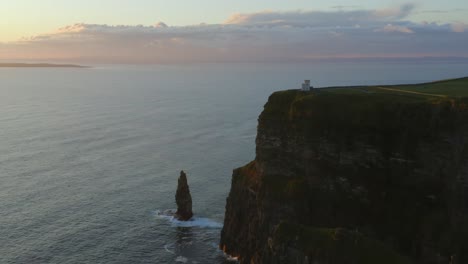 Imponent-Tower-and-sea-stack-at-the-cliffs-of-Moher-at-sunset