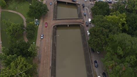 Drone-view-of-under-bridge-flooding-on-Allen-Parkway-in-Houston,-Texas