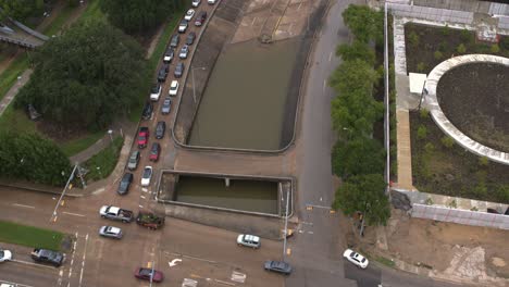 Drone-view-of-under-bridge-flooding-on-Allen-Parkway-in-Houston,-Texas