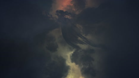 Cloud-Lightning---Eerie-spectacular-and-dramatic-lightening-storm-illuminating-dark-and-inspiring-angel-shaped-cloud-with-brilliant-and-intense-bolts-and-flashes-of-mystical-orange-lightning