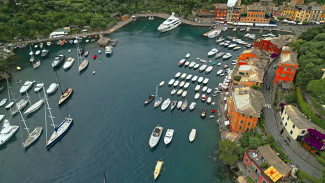 Portofino,-a-coastal-gem-in-Liguria,-Italy,-boasts-a-beautiful-harbor-filled-with-yachts-and-vibrant-buildings