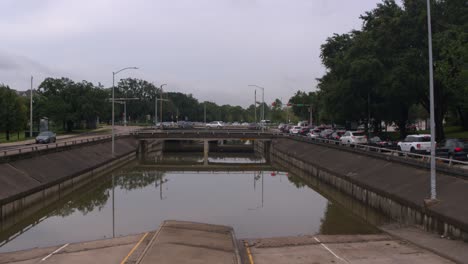 Drone-view-of-under-bridge-flooding-on-Allen-Parkway-in-Houston,-Texas