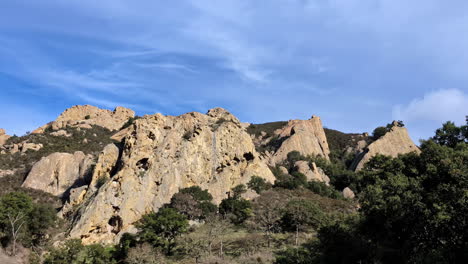 Static-view-on-the-big-Mammoth-Rocks-on-a-nice-sunny-day,-a-bird-is-flying-in-the-nature,-copy-space