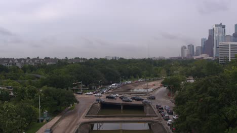 Ascending-shot-of-under-bridge-flooding-on-Allen-Parkway-in-Houston,-Texas