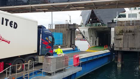 Barratlantic-Limited-frozen-and-chilled-distribution-lorry-driving-onto-Caledonian-Macbrayne-ferry-at-Oban-for-onwards-travel-to-Barra-in-the-Outer-Hebrides,-Scotland-UK