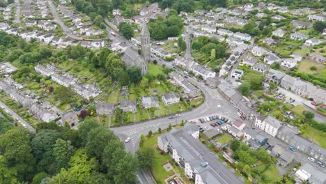 Aerial-view-of-the-historic-town-of-Tavistock-with-prominent-landmarks-and-greenery,-Devon,-UK