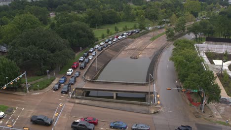 Birds-eye-view-of-under-bridge-flooding-on-Allen-Parkway-in-Houston,-Texas