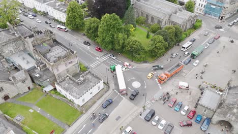 Aerial-view-of-a-crashed-lorry-causing-a-traffic-jam,-with-vehicles-backed-up-on-the-road