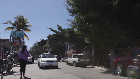 Cars-passing-by-on-a-small-street-in-Tegucigalpa,-Honduras