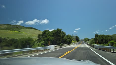 Driving-through-beautiful-scenery-on-a-sunny-day-in-California,-USA