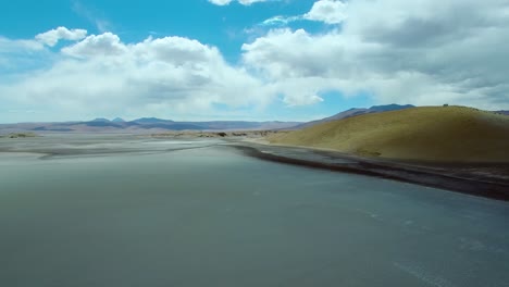 Drone-shot-across-salt-lake-and-lagoon-in-the-north-of-Chile,-near-Argentinean-border,-San-Pedro-de-Atacama-region