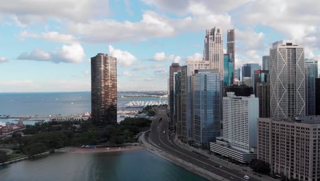 Aerial-drone-footage-in-and-around-Chicago's-Navy-Pier,-showing-beautiful-water,-yachts,-and-the-Chicago-skyline