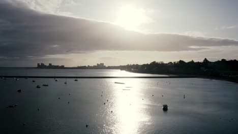 A-high-to-low-shot-of-expensive-yachts,-pleasure-boats-and-catamarans-docked-at-a-city-marina,-at-sunrise-|-Newhaven,-Edinburgh,-Scotland-|-4k-at-30-fps