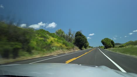 Driving-through-beautiful-scenery-on-a-sunny-day-in-California,-USA