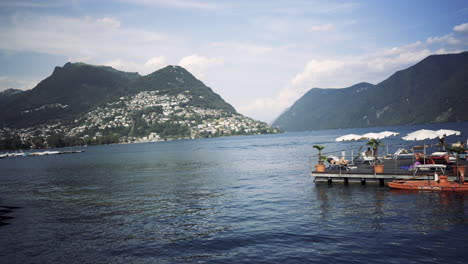 Panorama-view-of-the-lake-Lugano,-mountains-and-city-Lugano,-Ticino-canton,-Switzerland
