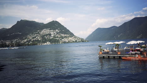 Vista-Panorámica-Del-Lago-De-Lugano,-Las-Montañas-Y-La-Ciudad-De-Lugano,-Cantón-De-Ticino,-Suiza