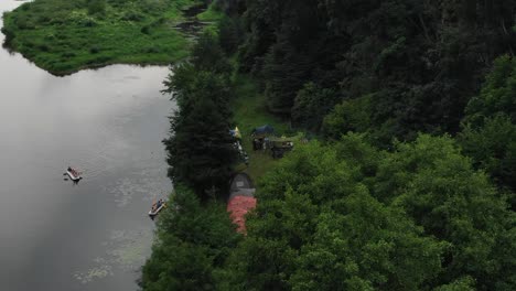 Aerial-View-of-People-Camping-in-Tents-in-the-Woods-Along-a-River