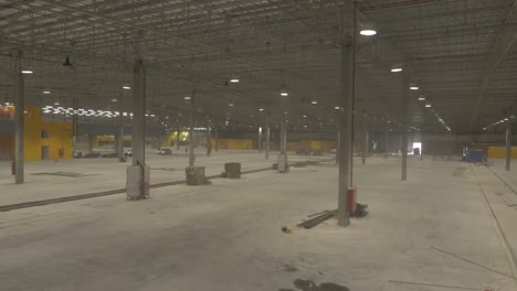 Empty-Warehouse-being-Constructed,-Huge,-spacious-hangar