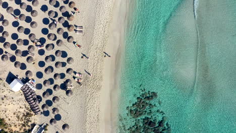 Aerial-top-down-view-of-a-majestic-sandy-beach-on-a-sunny-day