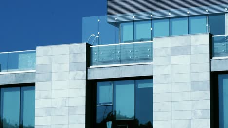 Wide-shot-static-view-of-buildings-in-downtown-glass-railing-rooftop-pool-office-corporate-buildings-water-flowing-sunset-light-[HD1920-x-1080]-fps29