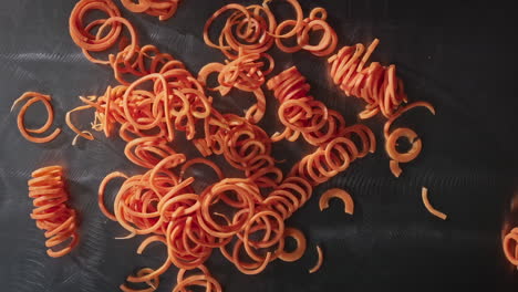 Sliced-carrots-falling-in-slow-motion-table-top