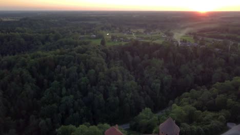 Scenic-sunset-overhead-flight-above-iconic-landmark-Turaida-Castle,-Latvia