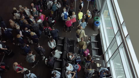 A-birds-eye-view-of-people-starting-to-move-towards-their-gate-to-board-a-flight