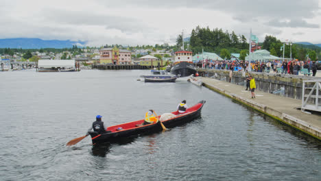 People-Crew-Rowing-Canoe-Towards-Marina-Deck-at-Port-Alberni,-British-Columbia-Canada