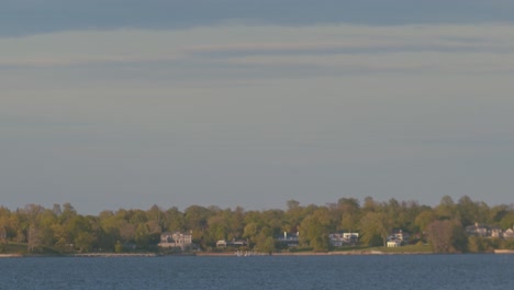 Tilt-reveal-of-long-island-sound-and-shore-view-from-Ft