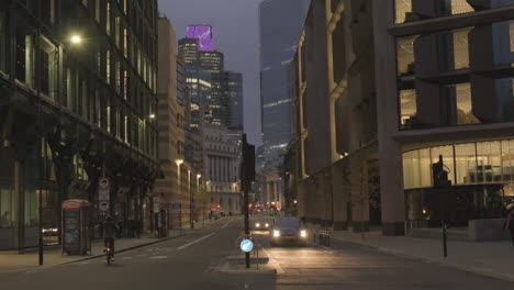 Quiet-Early-Morning,-Queen-Victoria-Street-Looking-Towards-Bank-Station,-Commuters-Walking-and-Cycling-to-Work,-Bank-of-England-and-8-Bishopsgate-in-Background