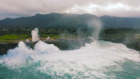 Aerial-front-view-of-the-cliff-and-mountain-behind