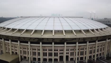 Drone-shot-of-the-Luzhniki-Stadium-moving-up-and-revealing-the-city-behind-it