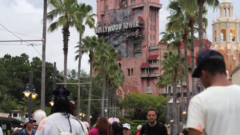 People-walk-towards-the-tower-of-terror-in-slow-motion-at-Disney-World