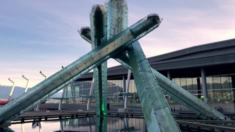 Tilt-down-to-show-the-entire-Vancouver-olympic-cauldron-flameless-and-the-calm-fountain-pool