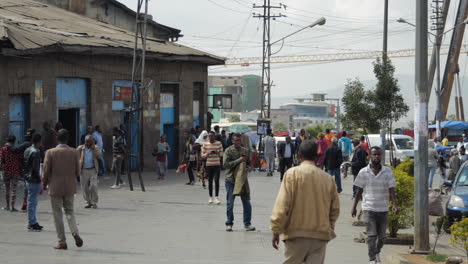 Pedestrian-traffic,-people-walk-on-street-of-Addis-Ababa,-Ethiopia