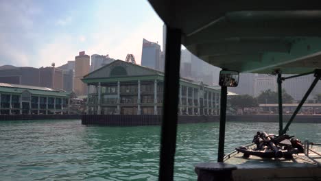 Ferry-Boat-Arriving-at-Pier-on-a-Sunny-Day-in-City-of-Hong-Kong