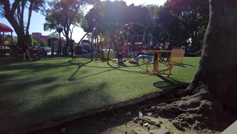 People-gathering-and-enjoying-an-afternoon-in-the-park-at-the-downtown-city-square-wearing-masks-during-the-pandemic