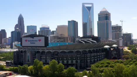 Establishing-Aerial-of-NFL-Stadium-and-Downtown-Charlotte,-North-Carolina