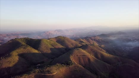 Aerial-pan-over-mountain-range-near-Engenheiro-Paulo-de-Frontin,-Brazil