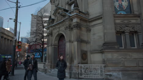 Driving-down-Front-street-past-the-hockey-hall-of-fame-and-Meridian-Hall-on-a-bright-and-sunny-day-in-Toronto,-Canada