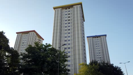 Three-tall-residential-buildings-in-Camden-Town,-London-handheld,-stabilized