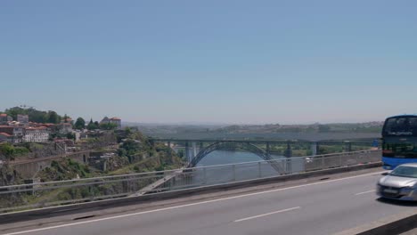 Bus-tour-view-of-Ponte-de-São-João-Bridge,-Porto,-Portugal-on-bright-clear-sunny-summer-day