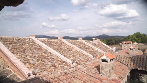 Handheld-shot-of-stone-roofs-on-residential-rustic-buildings