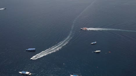 Aerial-shot-of-yachts-and-boats-in-the-coast-Gili-Trawangan,-near-Bali,-Indonesia