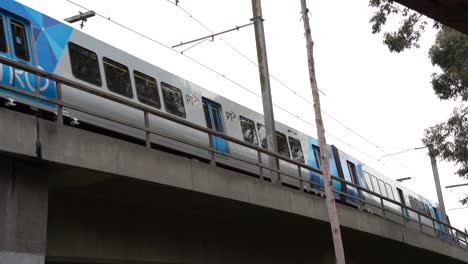 Melbourne-public-transport-PTV-Metro-train-running-on-railroad